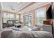 Inviting sunroom with comfortable seating, and sliding glass doors to the outdoor patio at 120 Swallowtail Ct., Little River, SC 29566