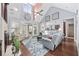 Bright and airy living room with a fireplace, large windows, and a seamless flow to the outdoor space at 120 Swallowtail Ct., Little River, SC 29566