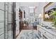 Grand living room featuring soaring ceilings, a fireplace, hardwood floors, and plenty of natural light at 120 Swallowtail Ct., Little River, SC 29566