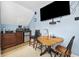 Upstairs living space with kitchenette, tv and seating with drop leaf table and carpet at 120 Swallowtail Ct., Little River, SC 29566