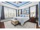 Relaxing bedroom featuring custom paint, tray ceilings, and lots of natural light at 120 Swallowtail Ct., Little River, SC 29566