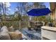 Outdoor patio featuring a dining table with umbrella and comfortable seating for outdoor relaxation at 120 Swallowtail Ct., Little River, SC 29566