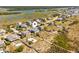 Beautiful aerial view of home, coastal community, and the surrounding waterway at 1257 Ocean Blvd., Holden Beach, NC 28462