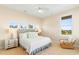 Serene bedroom with plush carpeting, soft lighting, and multiple windows, creating a relaxing retreat at 1257 Ocean Blvd., Holden Beach, NC 28462