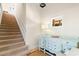Inviting entryway featuring staircase, console table, and coastal decor at 1257 Ocean Blvd., Holden Beach, NC 28462