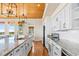 The expansive kitchen island is equipped with a sink and dishwasher and granite counters at 1257 Ocean Blvd., Holden Beach, NC 28462