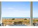 Scenic view from the porch of a beach home, with the ocean and sand dunes visible at 1257 Ocean Blvd., Holden Beach, NC 28462