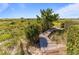Scenic boardwalk winding through lush greenery and sand dunes towards the ocean at 1257 Ocean Blvd., Holden Beach, NC 28462