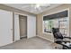 Cozy bedroom features a ceiling fan, closet and window with a view to the back yard at 1336 Gailard Dr., Conway, SC 29526