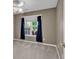 Comfortable bedroom with ceiling fan and nice window with blue and green curtains at 1336 Gailard Dr., Conway, SC 29526