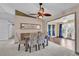 Elegant dining area with neutral carpet, modern furniture, and a view into the bright sunroom, ideal for gatherings at 1336 Gailard Dr., Conway, SC 29526