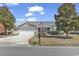 Charming single-story home featuring an attached two-car garage, a well-manicured lawn, and mature trees on a sunny day at 1336 Gailard Dr., Conway, SC 29526