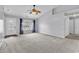 Clean living room with neutral carpet, a front door with decorative glass, and natural light, ideal for comfort at 1336 Gailard Dr., Conway, SC 29526