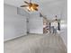 Spacious living room with neutral carpeting, ceiling fan, and vaulted ceiling showcasing the home's open layout at 1336 Gailard Dr., Conway, SC 29526