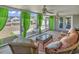 Comfortable screened porch seating area with nice view of the backyard and pond at 1336 Gailard Dr., Conway, SC 29526