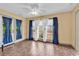Sun-drenched sunroom with tile flooring, bright windows, and stylish curtains, perfect for relaxation at 1336 Gailard Dr., Conway, SC 29526