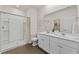 Bright bathroom featuring a double vanity, a walk-in shower, and tile flooring at 1356 Palm Springs Paloma Dr, Longs, SC 29568