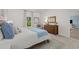 Stylishly decorated bedroom with a comfortable bed, dresser, and coordinated decor at 1356 Palm Springs Paloma Dr, Longs, SC 29568