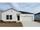 This is a lovely single story home with attached garage and a manicured lawn at 1356 Palm Springs Paloma Dr, Longs, SC 29568