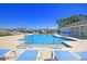 Community pool area with lounge chairs and neighborhood views at 1356 Palm Springs Paloma Dr, Longs, SC 29568
