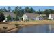 Exterior backyard view of home and pond at 1439 Castleberry Pl., Myrtle Beach, SC 29588