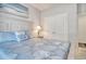 Coastal bedroom featuring an ocean themed painting over the bed and a large double door closet at 1439 Castleberry Pl., Myrtle Beach, SC 29588
