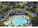 Aerial view showing the community pool, lounge chairs and landscaping at 1439 Castleberry Pl., Myrtle Beach, SC 29588