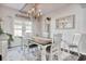 An elegant dining room with chandelier lighting at 1439 Castleberry Pl., Myrtle Beach, SC 29588