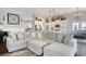 Open-concept living area showcasing a large sectional sofa with views of the kitchen and dining spaces at 1439 Castleberry Pl., Myrtle Beach, SC 29588