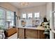 A well-lit office with a large window, desk, and built-in shelving at 1439 Castleberry Pl., Myrtle Beach, SC 29588