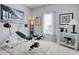 Home workout room with full weight set, neutral colors, natural light, and calming beachy decor at 1439 Castleberry Pl., Myrtle Beach, SC 29588