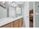 Bright bathroom featuring a spacious vanity, wood cabinets, and ample lighting at 145 South Dunes Dr. # 503, Pawleys Island, SC 29585
