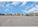 Expansive beachfront view featuring multiple condo buildings and boardwalks under a bright blue sky with scattered clouds at 145 South Dunes Dr. # 503, Pawleys Island, SC 29585