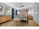 Bedroom with wood floors and furniture, ceiling fan, and iron bed frame at 145 South Dunes Dr. # 503, Pawleys Island, SC 29585