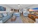 Comfortable living room with wood floors and an open floor plan at 145 South Dunes Dr. # 503, Pawleys Island, SC 29585
