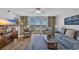 Comfortable living room with a view of the ocean and outdoor seating at 145 South Dunes Dr. # 503, Pawleys Island, SC 29585