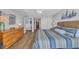 Coastal-themed main bedroom with wood-look floors and serene color palette at 145 South Dunes Dr. # 503, Pawleys Island, SC 29585