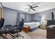 Cozy bedroom with blue walls, a ceiling fan, and a window with natural light at 1463 Gibson Ave., Surfside Beach, SC 29575