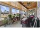 Charming sunroom with brick walls, wood ceiling, and lots of natural light from surrounding windows at 1463 Gibson Ave., Surfside Beach, SC 29575