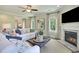 Bright living room with a fireplace, stylish decor, and a view of the backyard at 152 Azure Loop, Myrtle Beach, SC 29588