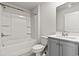 The cozy bathroom features shower and grey vanity at 1586 Jardine Loop, Little River, SC 29566