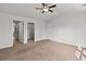 Neutral bedroom with carpet, ceiling fan, walk-in closet, and ensuite at 1586 Jardine Loop, Little River, SC 29566