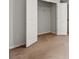 Bedroom showcasing an open closet with white wire shelving and neutral carpeting at 1586 Jardine Loop, Little River, SC 29566