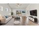 Stylish living room featuring hardwood floors, comfortable seating, and a modern entertainment center at 1586 Jardine Loop, Little River, SC 29566