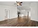 Spacious living room with hardwood floors open to kitchen at 1586 Jardine Loop, Little River, SC 29566