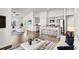 Open-concept living room showcasing modern décor, hardwood floors, and ample natural light at 1586 Jardine Loop, Little River, SC 29566