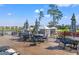 Outdoor patio space furnished with tables, chairs, and umbrellas at 1586 Jardine Loop, Little River, SC 29566