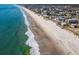 Breathtaking aerial view of the beach featuring crystal-clear water and pristine sandy shores near homes at 162 Norris Dr., Pawleys Island, SC 29585