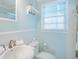 This cozy bathroom has a toilet, sink, mirror and shower at 162 Norris Dr., Pawleys Island, SC 29585