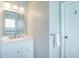 Well-lit bathroom featuring a white vanity with granite counter and glass-enclosed shower at 162 Norris Dr., Pawleys Island, SC 29585